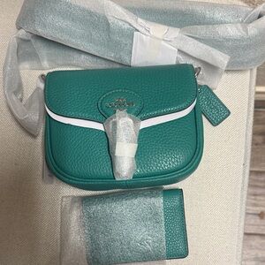 NWT,  Coach  Amelia small saddle bag in bright green/.  matching  card case .